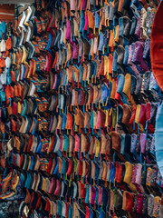 Colorful traditional handmade leather shoes on the market in Marrakech, Morocco.