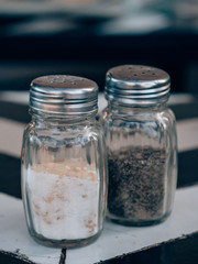 Salt and Pepper in front of a black and white background
