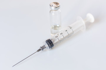 Medical glass vials and syringe for vaccination. Medical concept