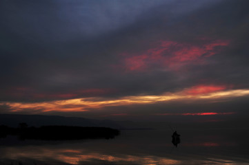 Naklejka na ściany i meble Beautiful sunset on lake