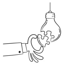 Hand put a part of light bulb puzzle, idea concept