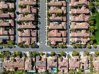 Aerial view suburban neighborhood with identical wealthy villas next to each other. San Diego,...