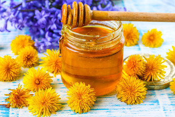 Honey from dandelions. Dandelion Honey in a Glass Jar.