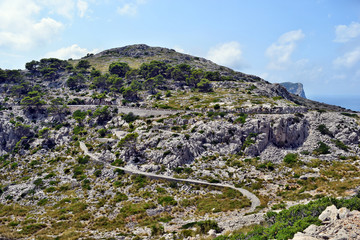 Open coastal road winding through to lighthouse Cap Formentor