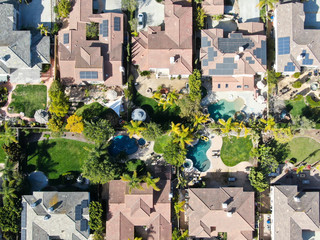 Aerial view suburban neighborhood with identical wealthy villas next to each other. San Diego,...