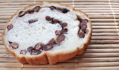 Sliced bread with red bean paste on wooden