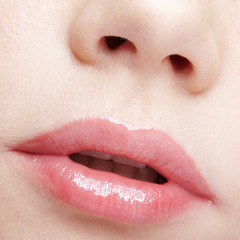 Obraz premium Closeup macro portrait of female part of face. Human woman lips with day beauty makeup