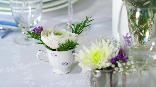 Decorating a table with beautiful flower decorations.