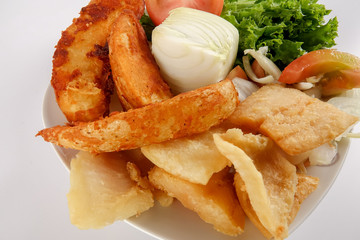 Fish and Chips with vegatables isolated on white.