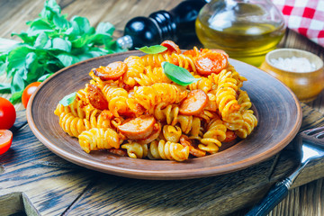 Pasta with sausage in tomato sauce, italian food
