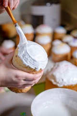 Baker brush white egg and sugar icing on the top of Easter cakes
