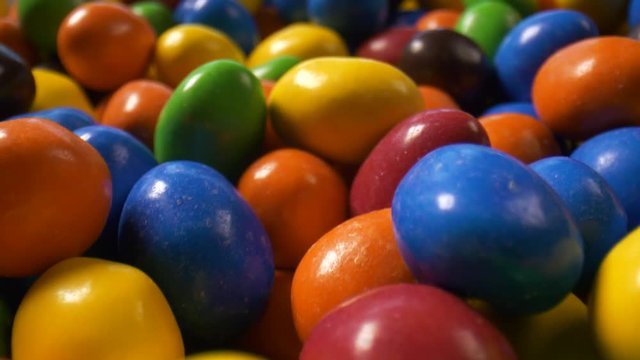 Macro close-up travel over a pile of colorful candies