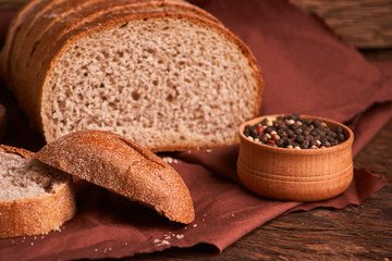 Peppercorns in a wooden bowl on table with food rustic style. Homemade food