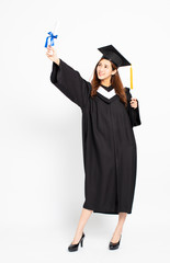 smiling asian girl graduation with diploma