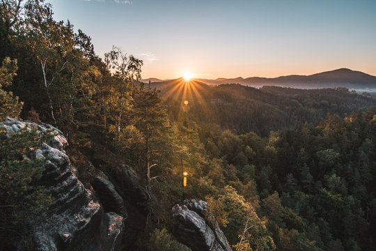 Summer landscape in mountains with the sun