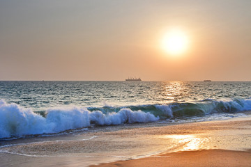 India, Kerala. Beach of the Indian ocean at sunset