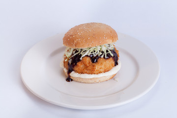  Fast food, delicious fish burger, beautifully laid out on a wooden background, for culinary design