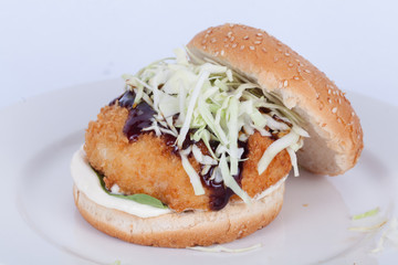  Fast food, delicious fish burger, beautifully laid out on a wooden background, for culinary design