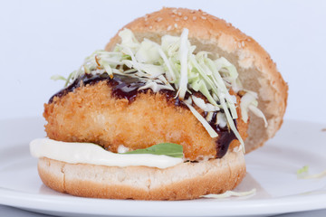  Fast food, delicious fish burger, beautifully laid out on a wooden background, for culinary design