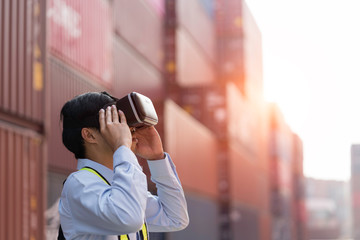 Businessman in virtual reality glasses and truck with cargo container