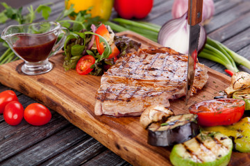  juicy and appetizing steak tamogavok of horse meat on the table, for design in cooking