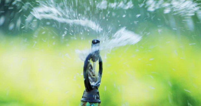 Close up of springer watering in the  garden,water springer running ,Natural background