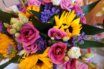 Bouquet of multicolored flowers on a dark background. Colorful bouquet of different fresh flowers. Rustic flower background. close-up