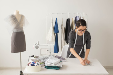 Dressmaker, fashion designer and tailor concept - Young woman designer, process of creating a dress