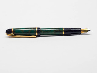 Classic fountain pen denoting status and formality when signing official documents. Nib exposed for...