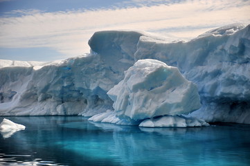Fototapeta na wymiar Icebergs. Blue ice, clear sea water.