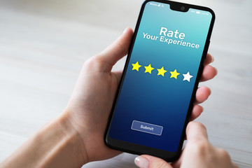 Rate your experience customer satisfaction review Five Stars on mobile phone screen. Business technology concept.