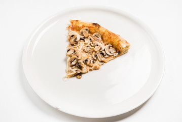slice of pizza on the white plate