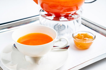 cup of tea with infuser and herbal tea