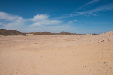 Fototapeta na wymiar Barren desert landscape in hot climate