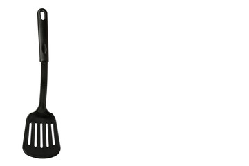 Black plastic kitchen spatula, kitchenware for cooking. Isolated
