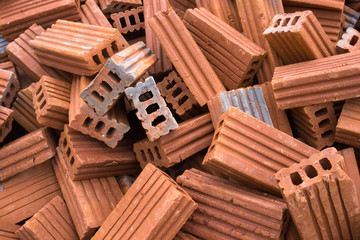 Pile of orange bricks for construction