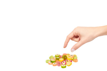 Hand with colored round candy, sugar lollipop