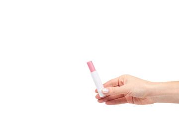 Hand with pink balm lipstick, lips care and beauty