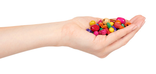 Hand with colored wooden beads, decorative accessory for hand made.