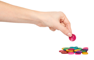 Hand with colorful sewing buttons, decoration accessory.