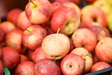 Fototapeta na wymiar Natural apples at marketplace.