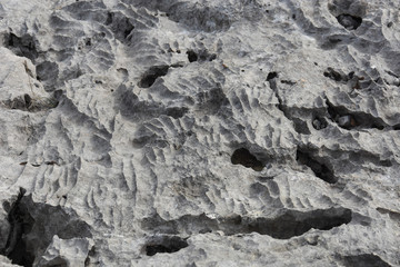 Rock formation in Sicevo gorge. Stone background, strange waves in the rock