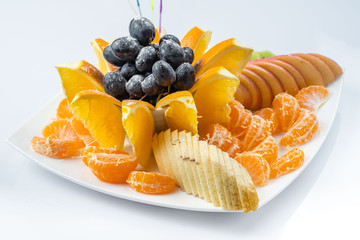 Mixed fruit in white plate isolated on white background - Healthy food style