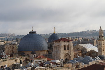 Fototapeta premium Sky over Jerusalem old town. View on the Jerusalem old town from the rooftop in the early morning