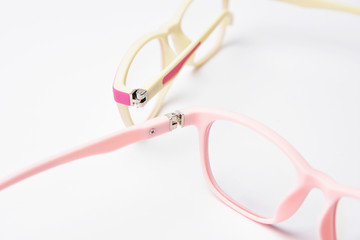 Back side view children's glasses plastic rim frame on white background