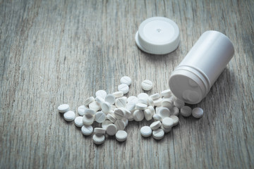 Sedative pills on wooden table