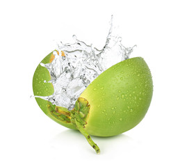 Green coconut with water splash isolated on white background.