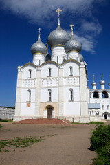 On a sunny summer day view of the Assumption Cathedral and the bell tower of the Rostov Kremlin. Gold ring of Russia