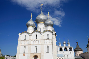 Fototapeta na wymiar On a sunny summer day view of the Assumption Cathedral, the bell tower and the towers of the Rostov Kremlin. Travel around the Golden Ring of Russia