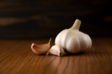 Garlic bulb on the wooden vintage background